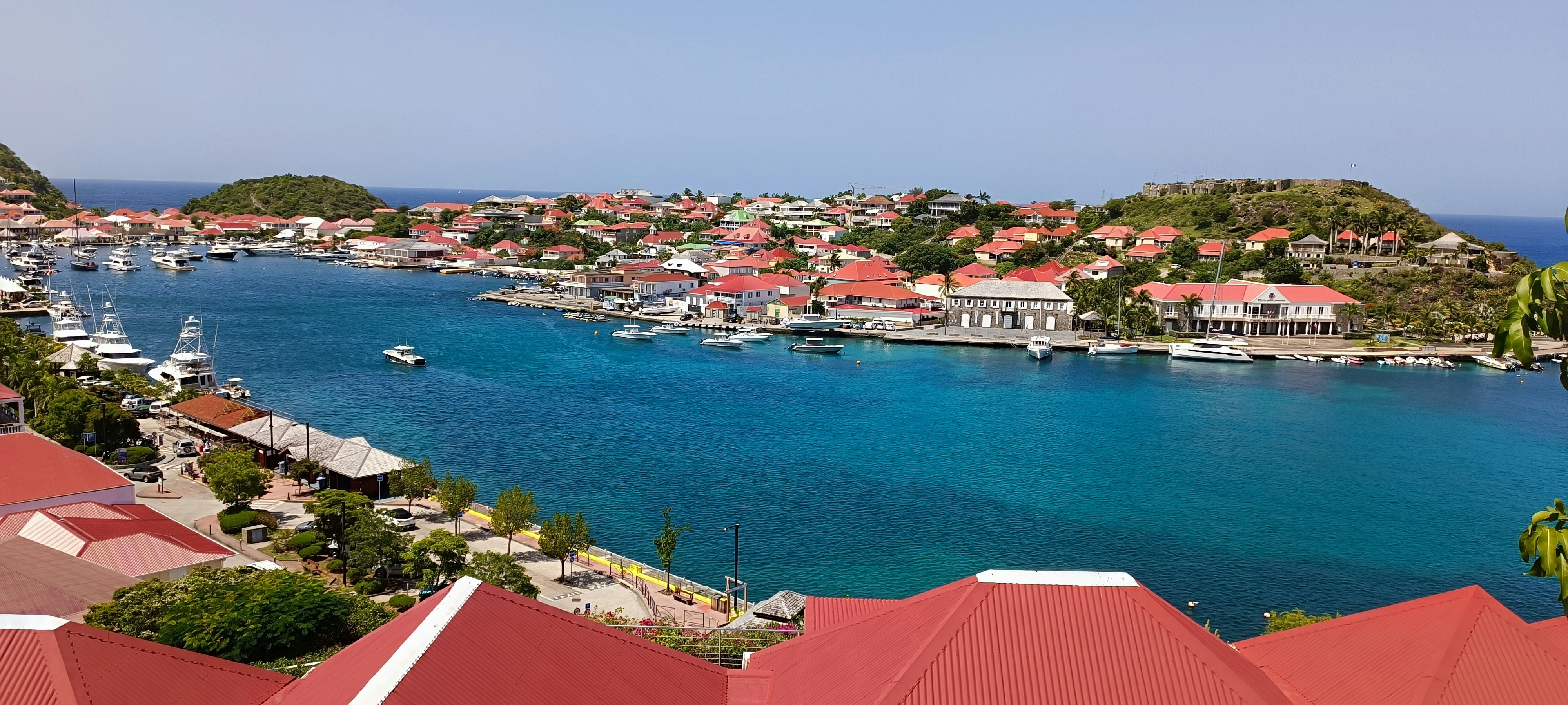 Gustavia harbour in St. Barth, red roofs and yachts on a turquoise bay