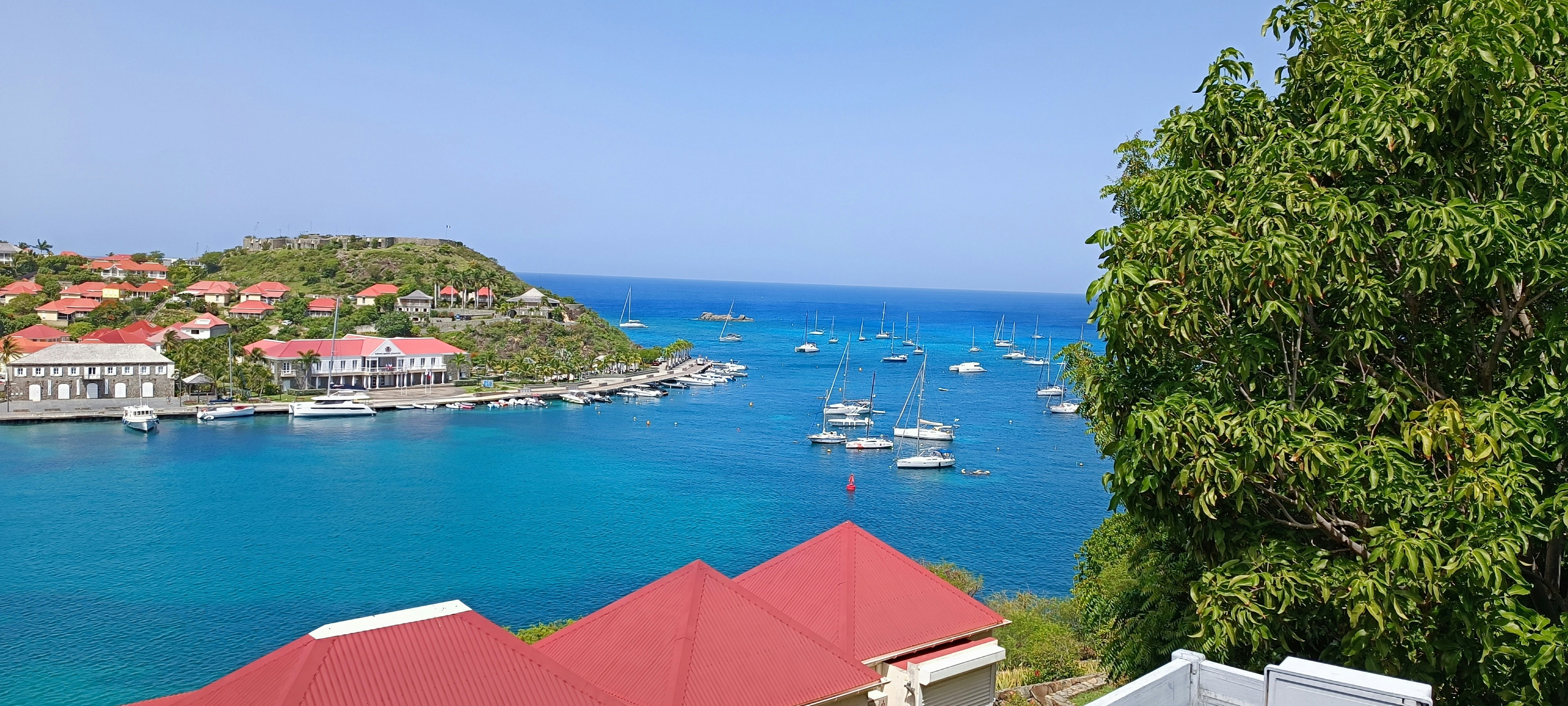a group of boats floating on top of a body of water