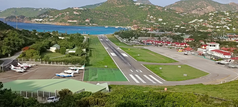an aerial view of a small town with a runway