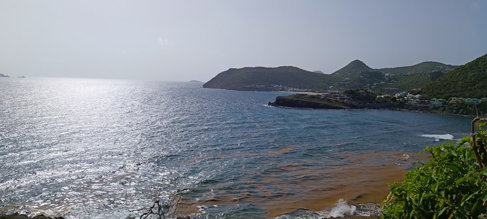 a body of water with a small island in the background