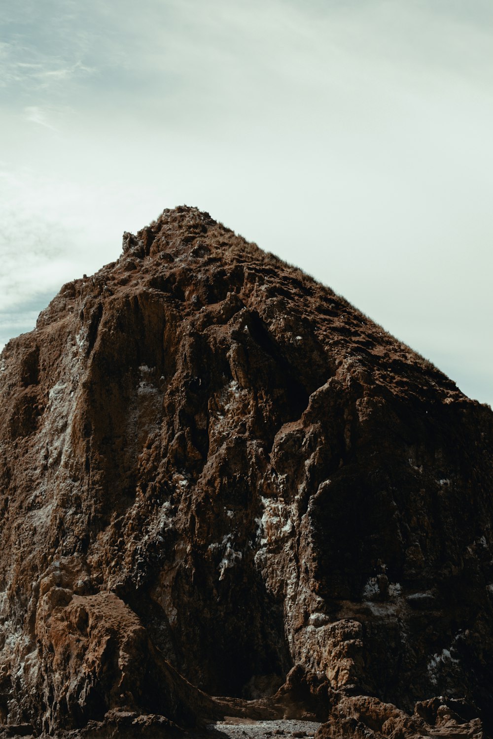 a person standing on top of a large rock