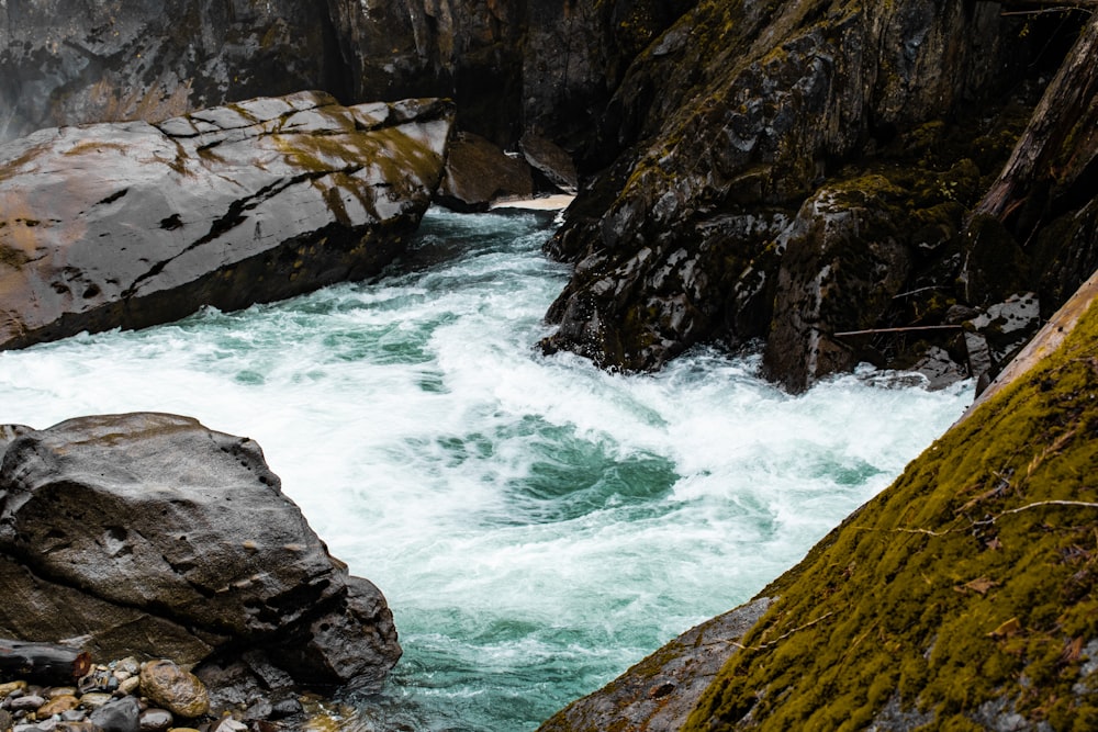 a river flowing between two large rocks