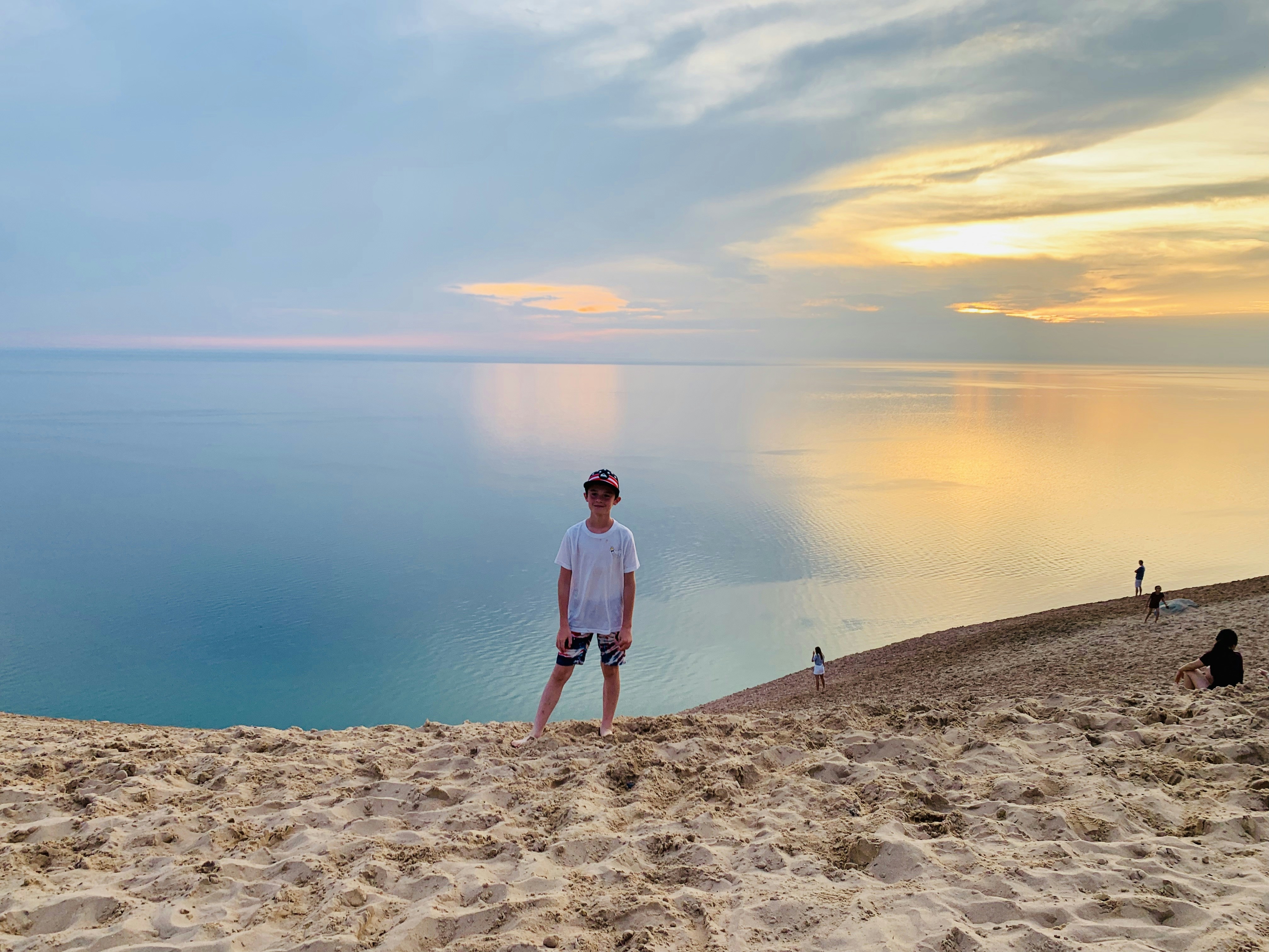 a man standing on top of a sandy beach