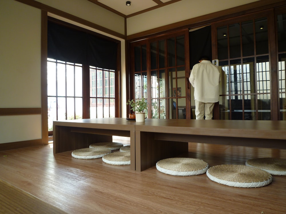 a room with wooden floors and a large window