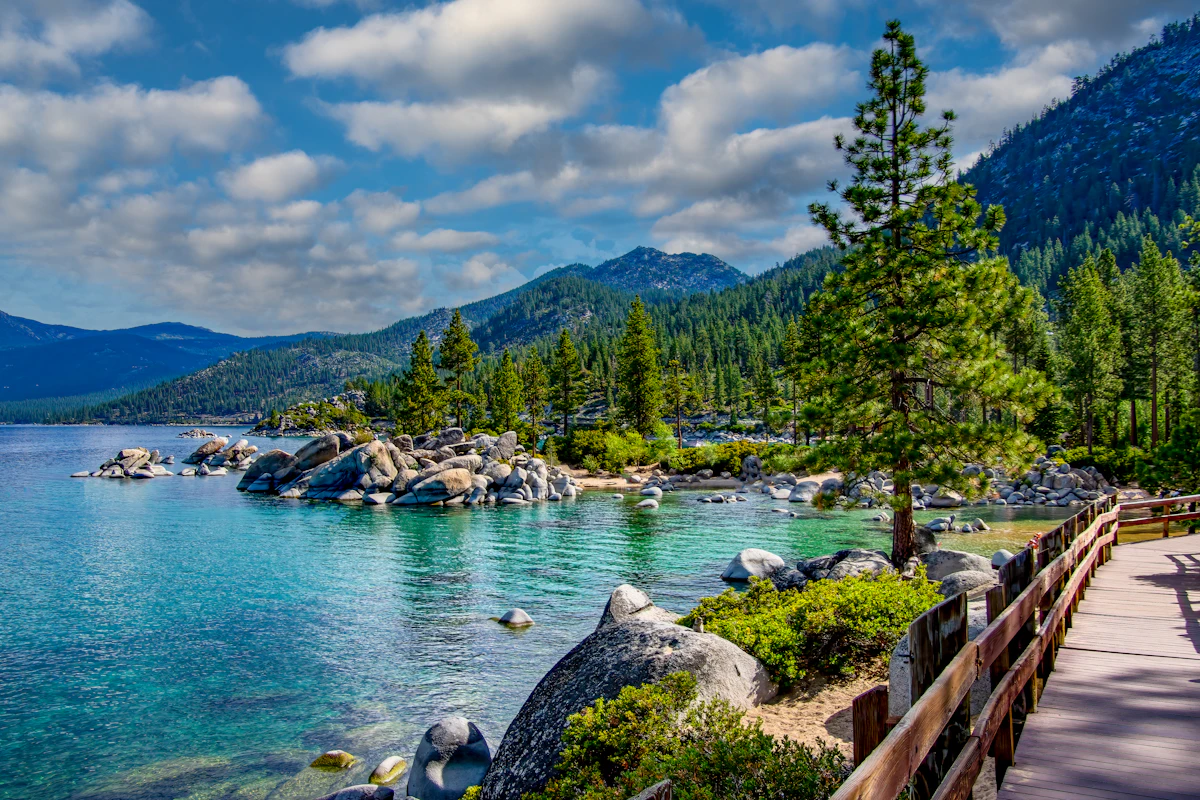 Clear turquoise water and boulders at Sand Harbor on the Nevada shore of Lake Tahoe, beside a boardwalk