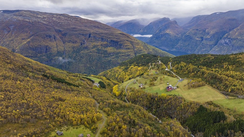 a scenic view of a valley surrounded by mountains