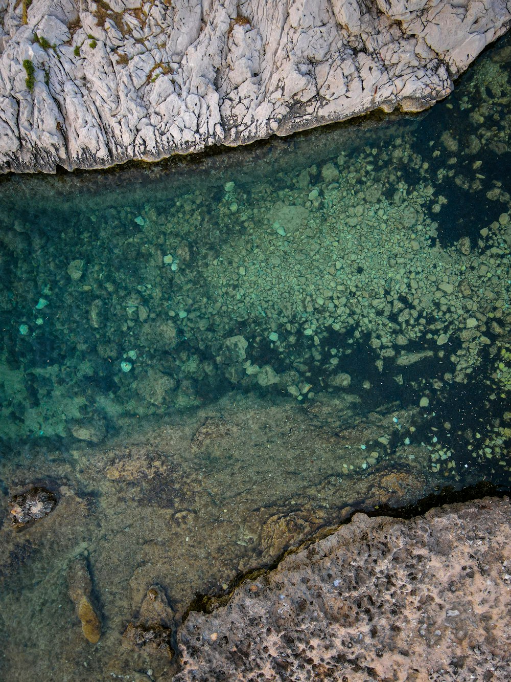 a large body of water surrounded by rocks