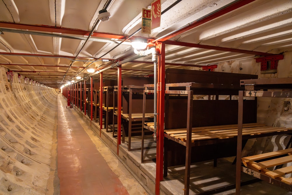 a long row of benches inside of a building