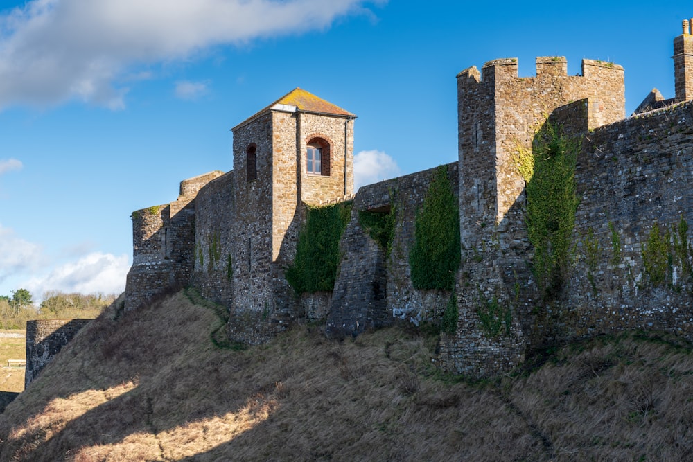 a stone castle with a clock tower on top of it