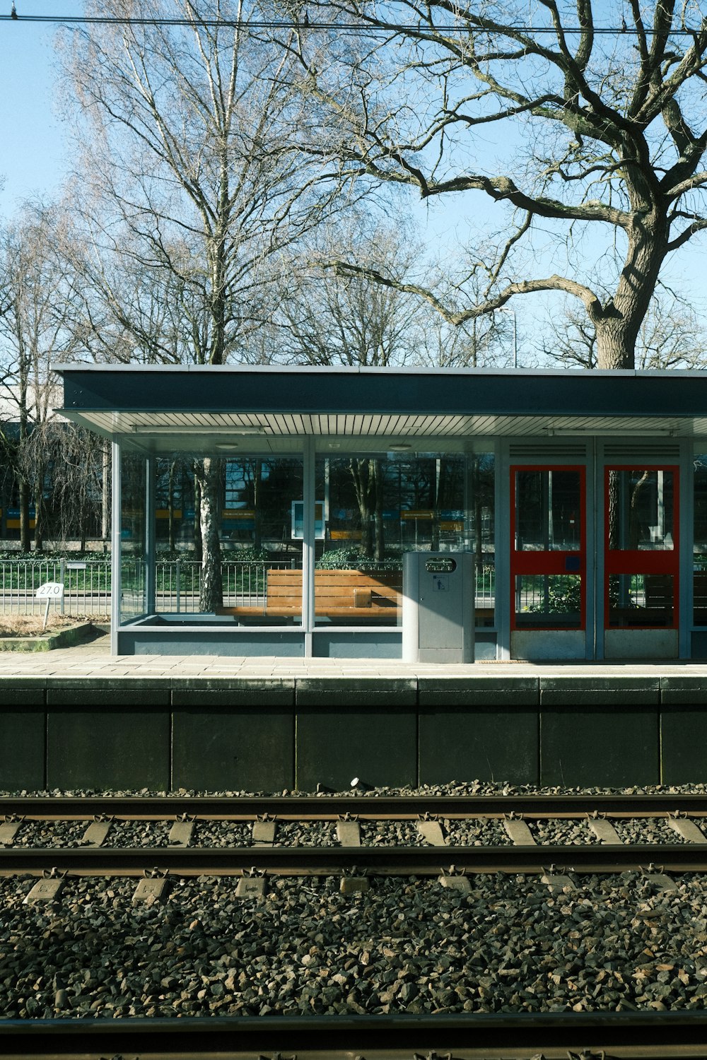 a train station sitting next to a train track