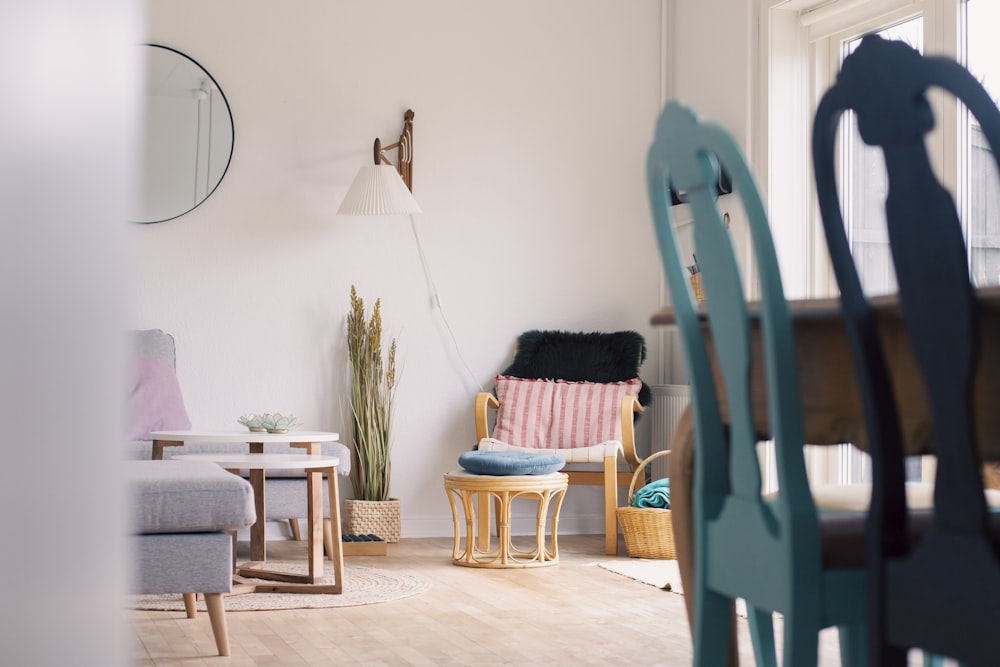 a living room filled with furniture and a wooden floor