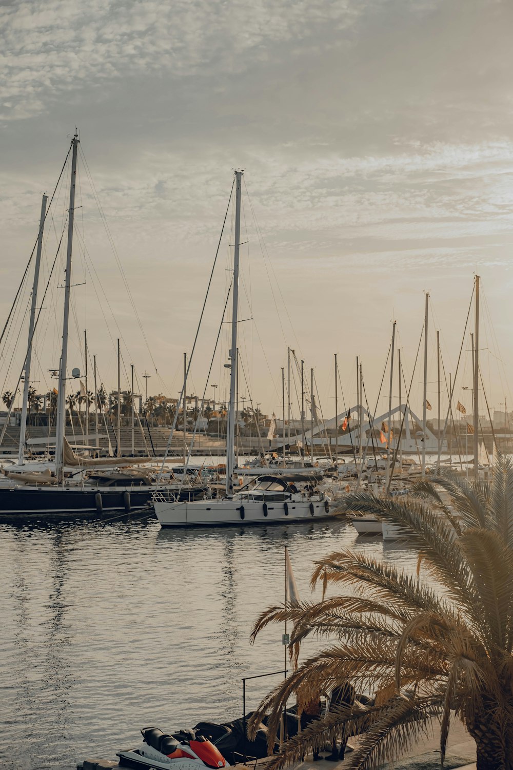 a harbor filled with lots of boats on top of water