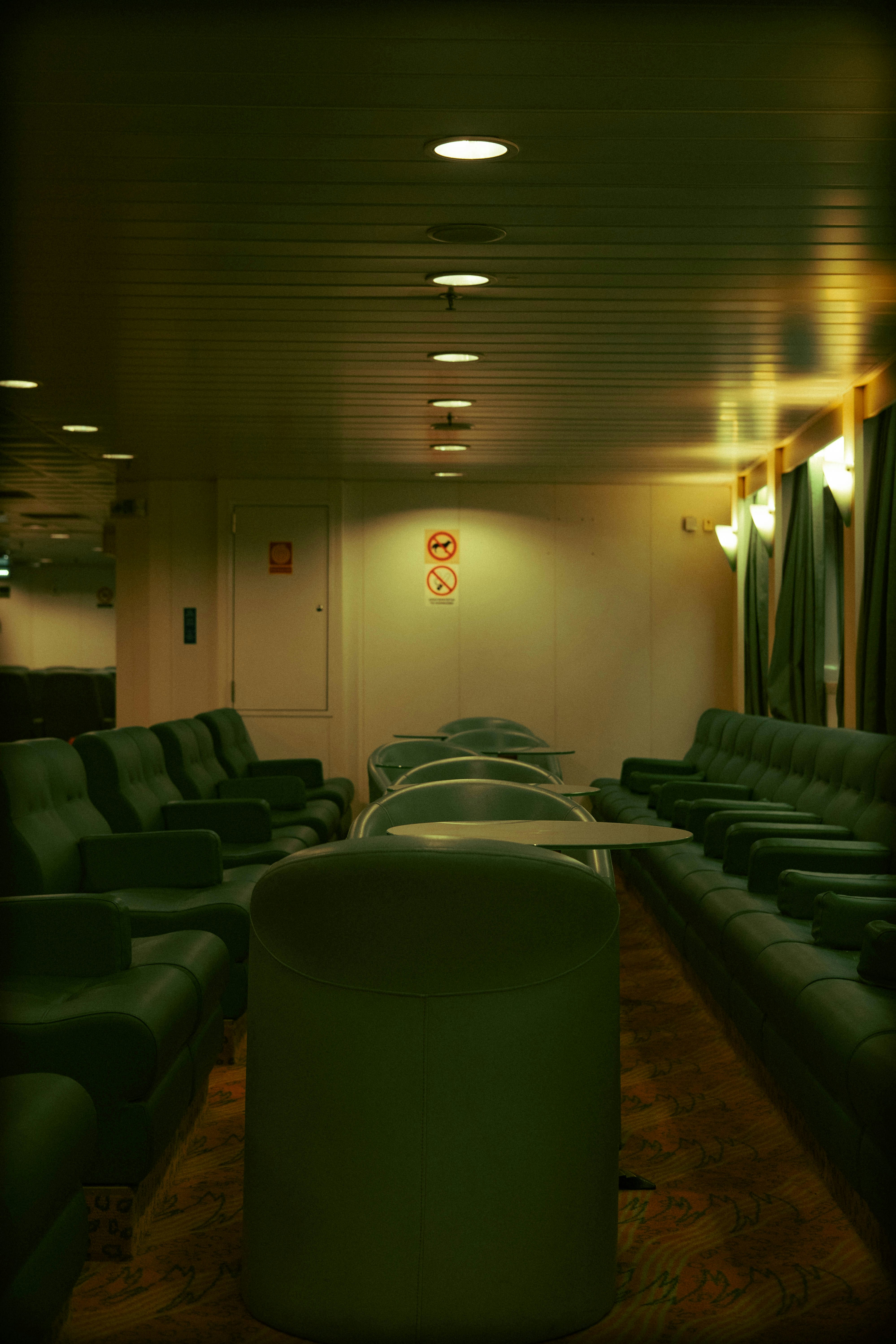 a room with a lot of couches and a table