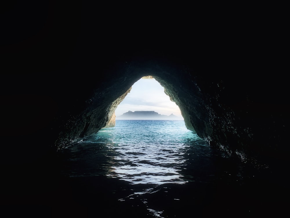 a view of the ocean from inside a cave