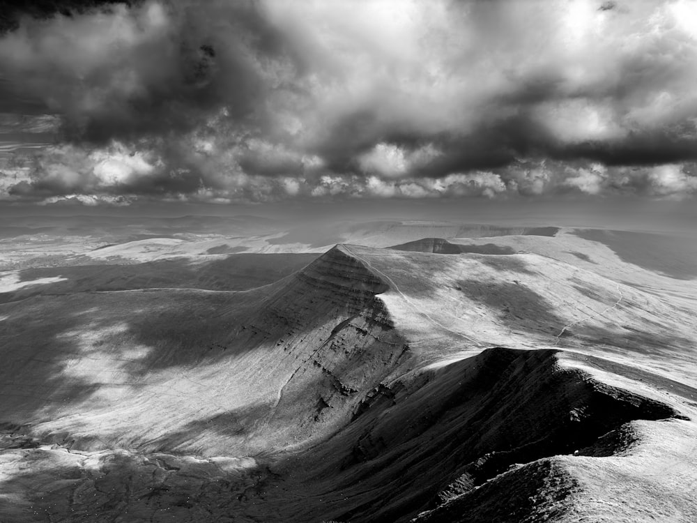 a black and white photo of a mountain range