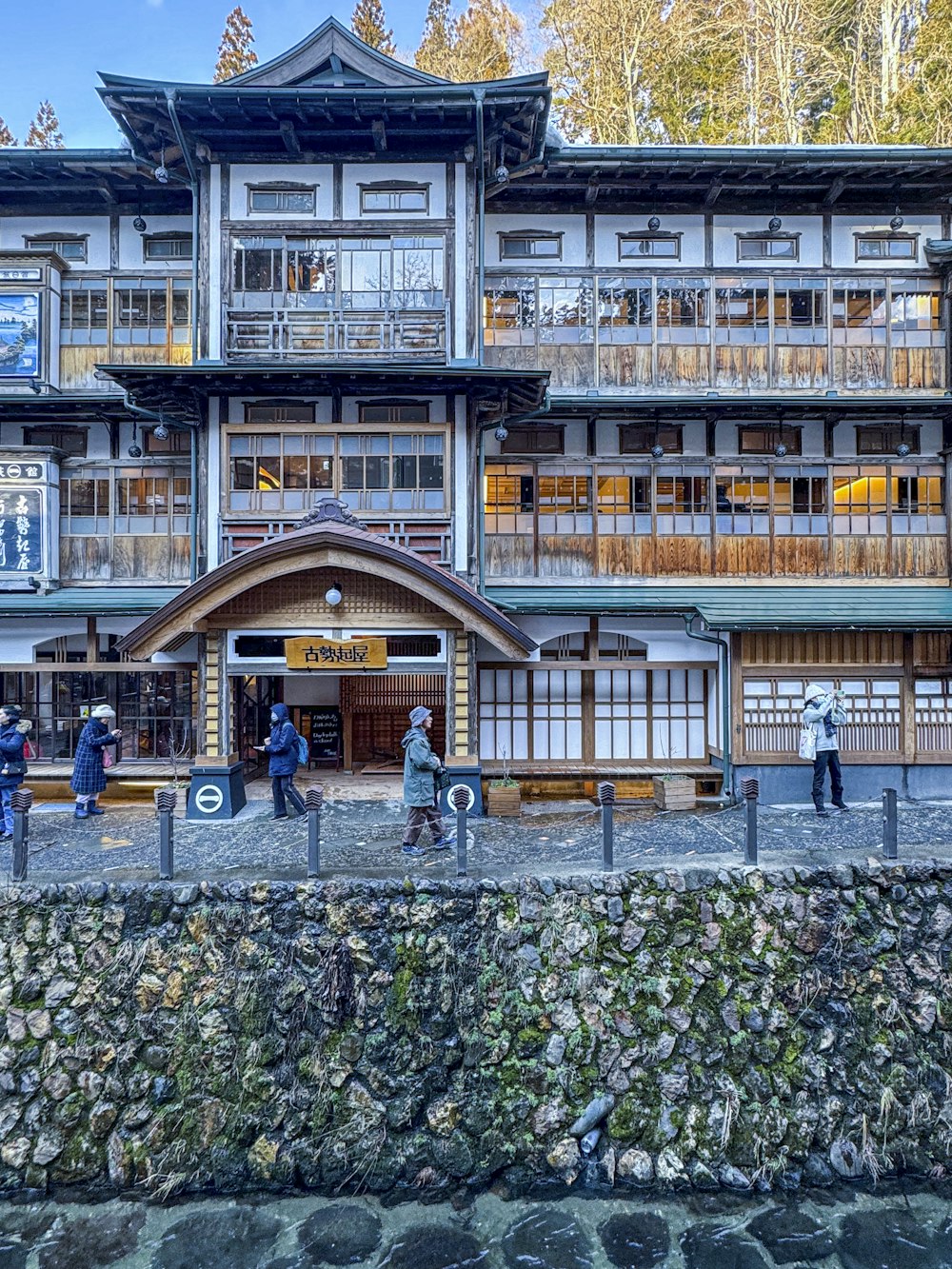 a group of people standing in front of a building