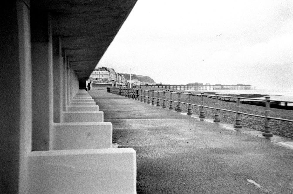 a black and white photo of a row of benches