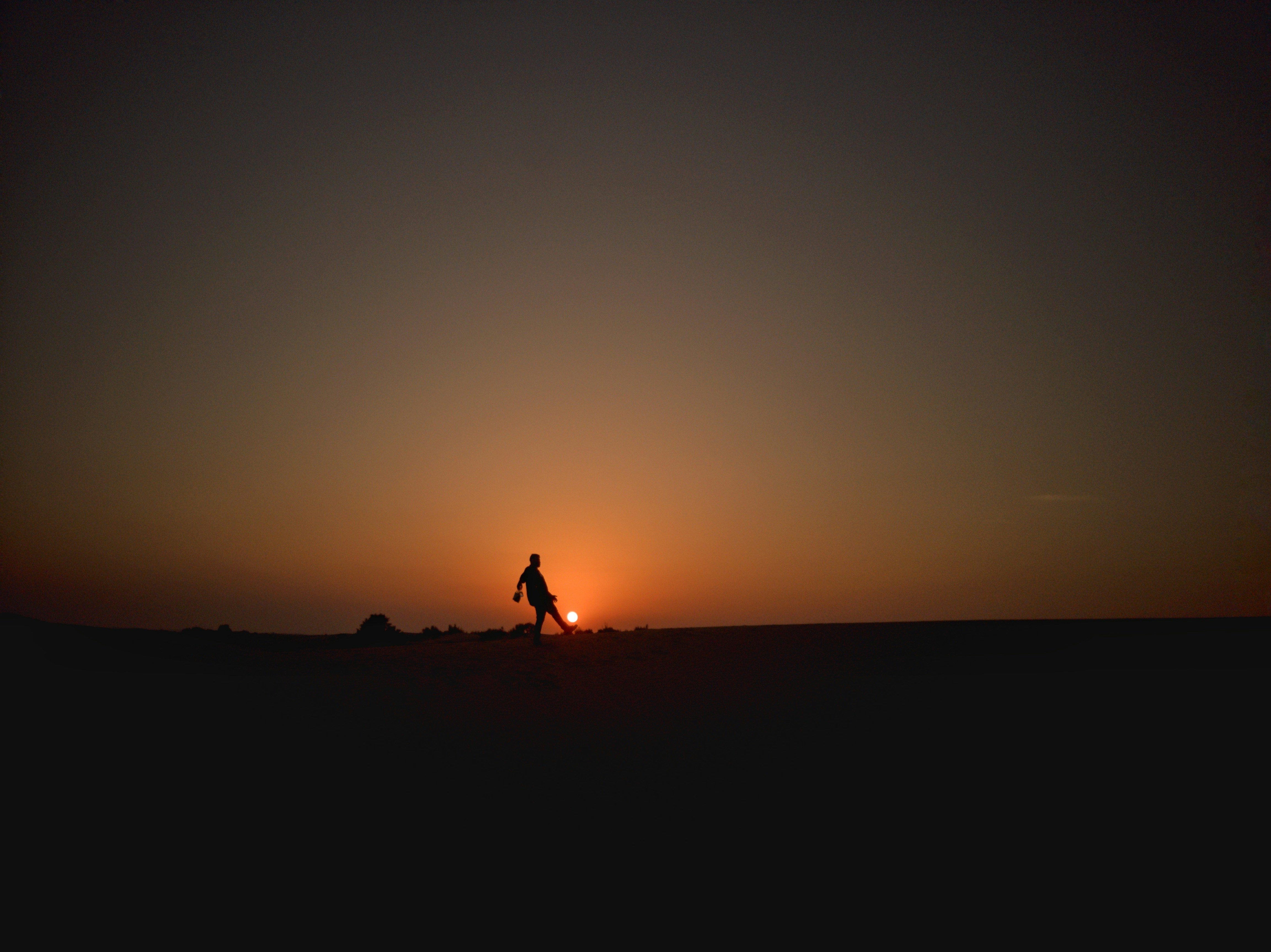 Soccer with the sun in desert