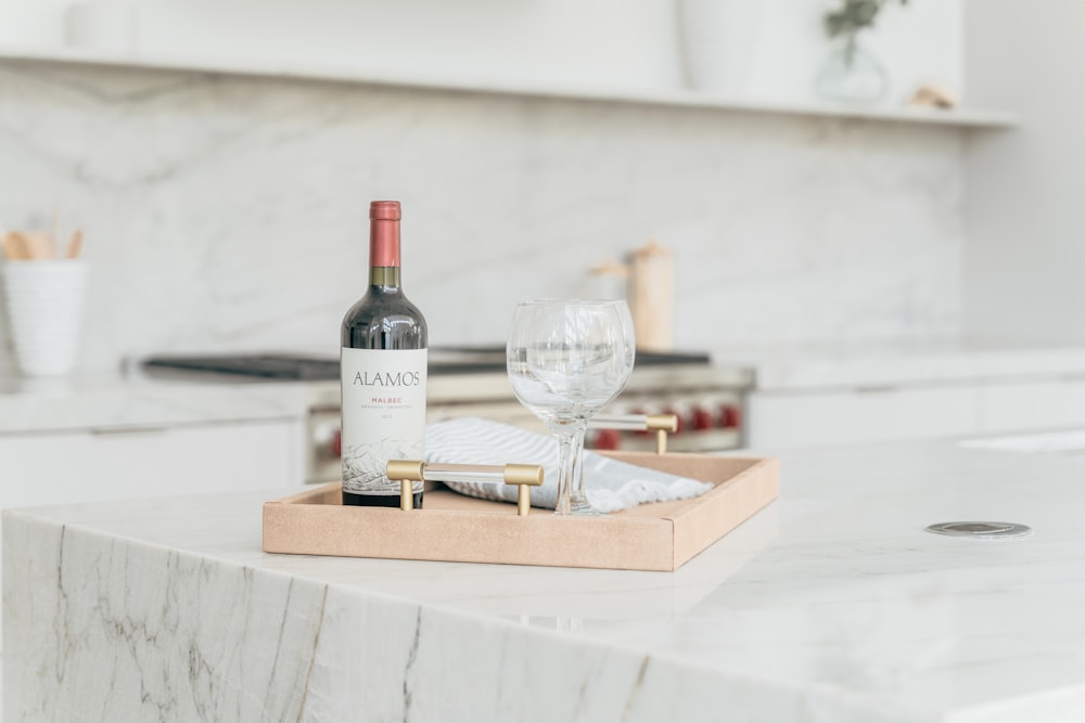 a bottle of wine sitting on top of a counter