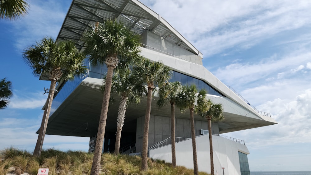 a building with palm trees in front of it