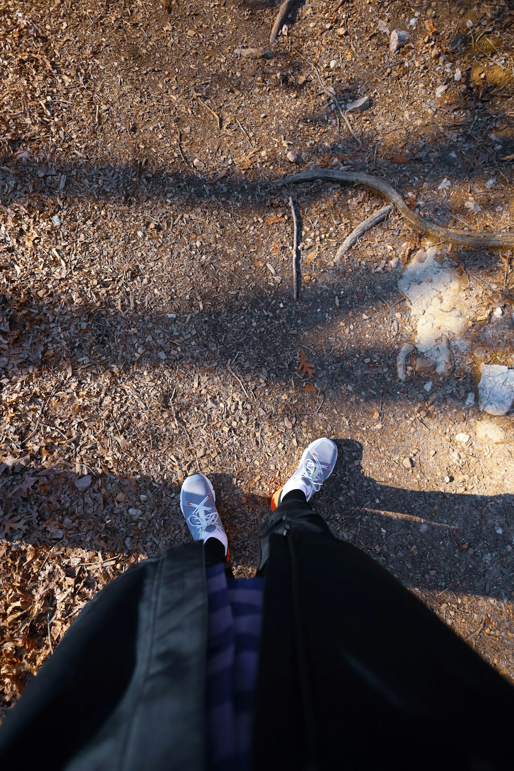 a person standing on top of a dirt field