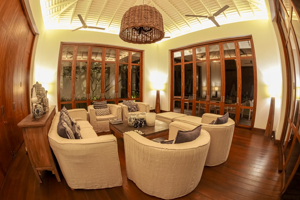 a living room filled with furniture and a chandelier