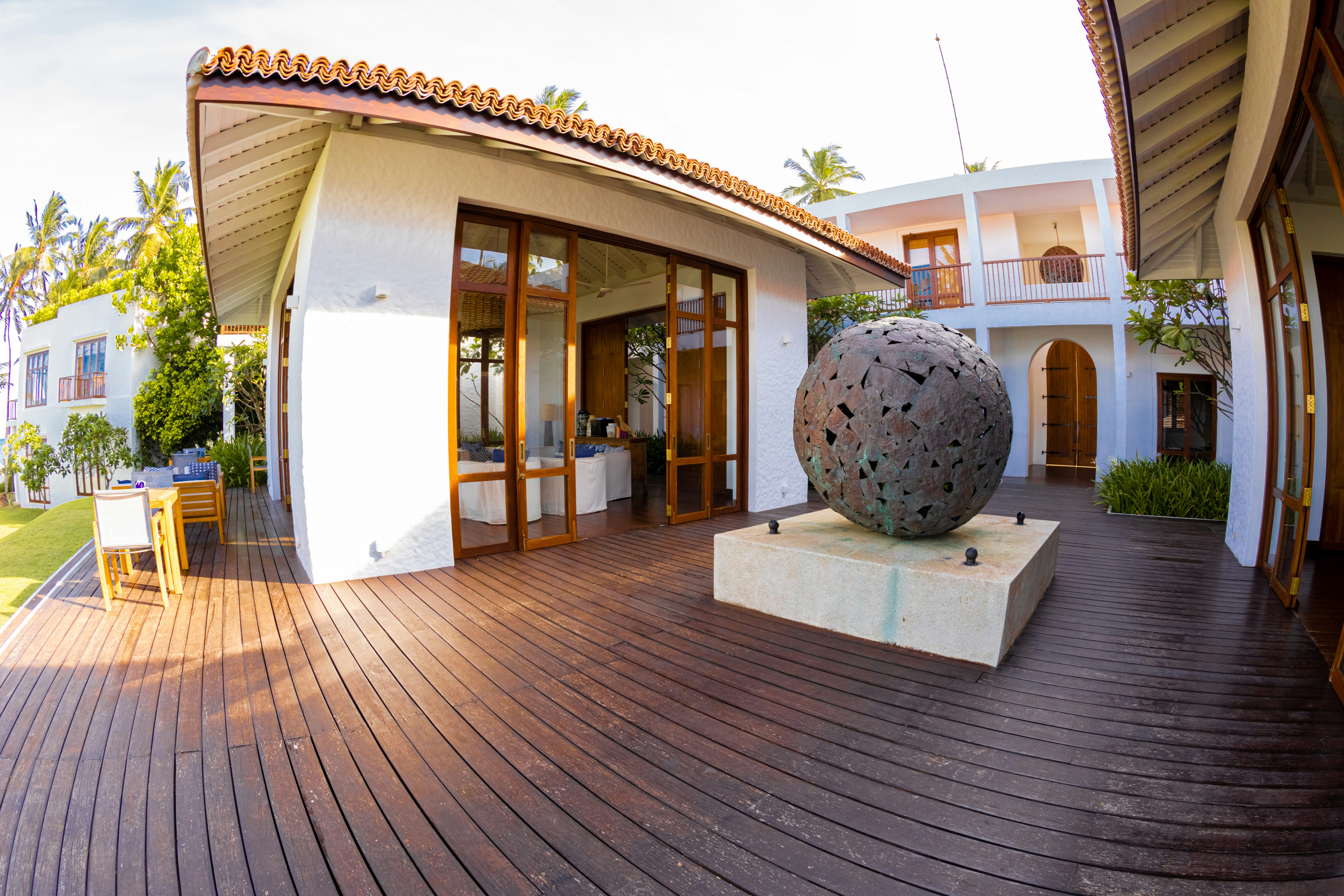 a large ball sitting on top of a wooden floor