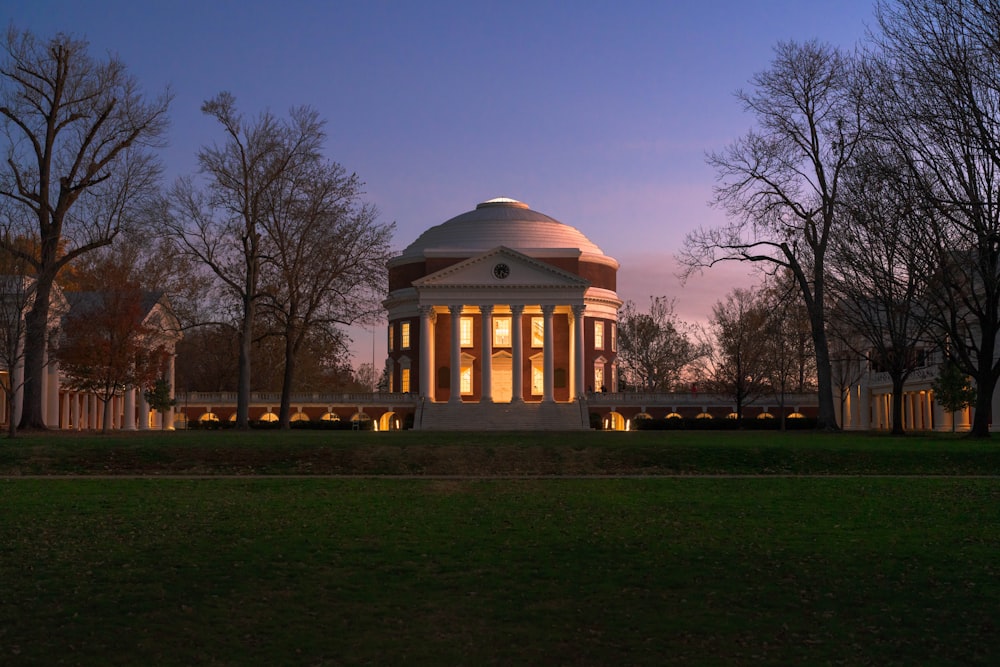 a large white building with lights on it's sides