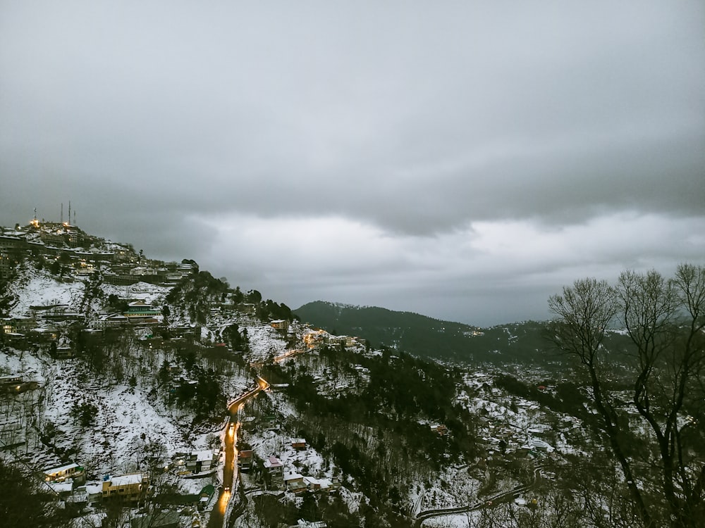 a view of a snowy mountain with a cloudy sky