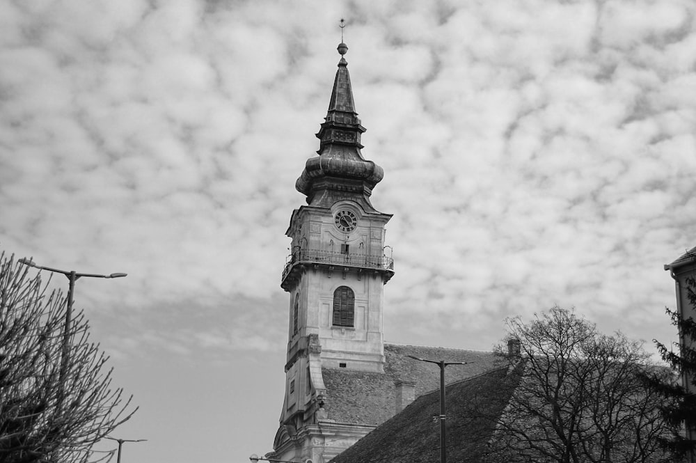 a black and white photo of a church steeple