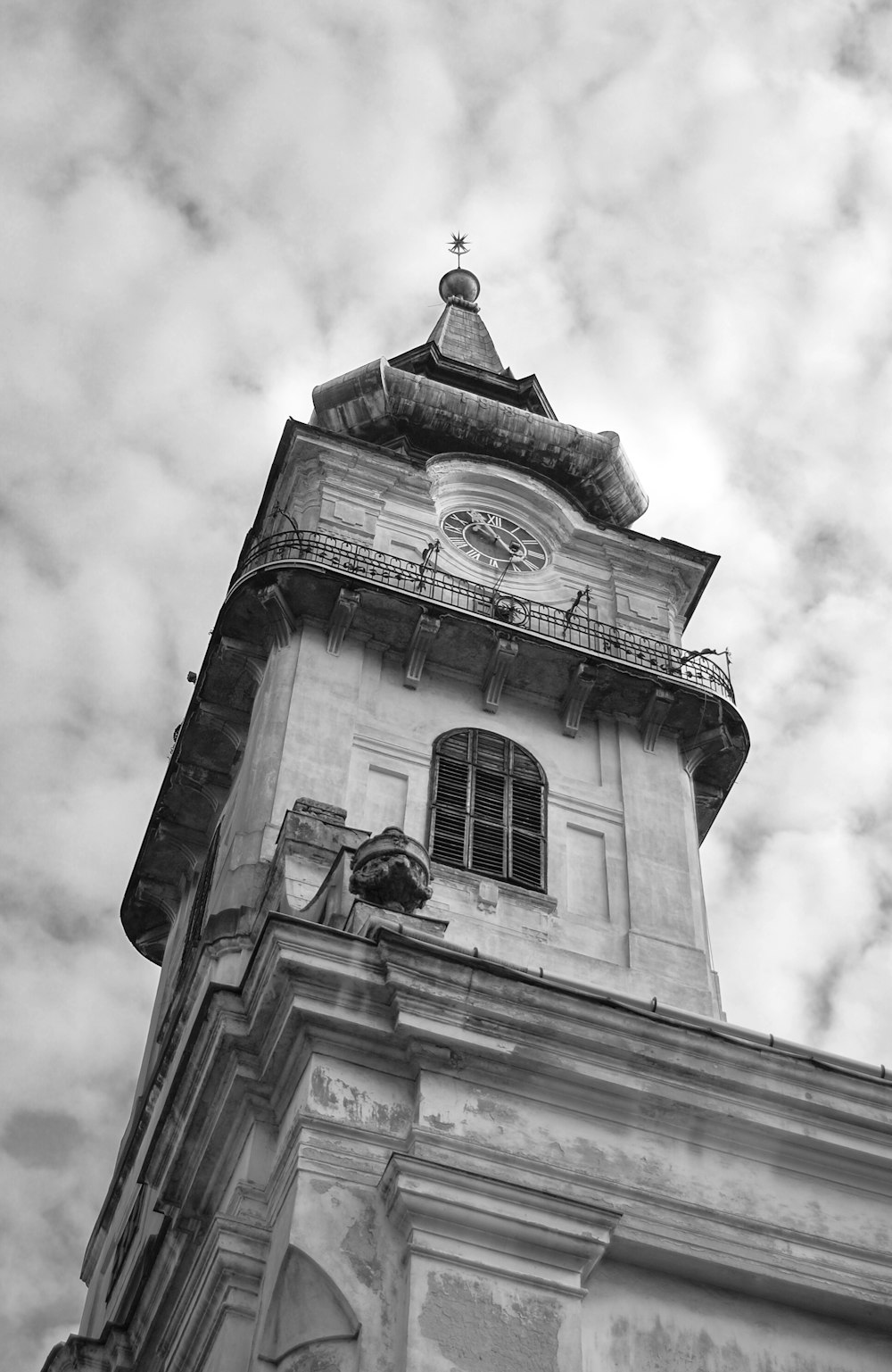 a black and white photo of a clock tower