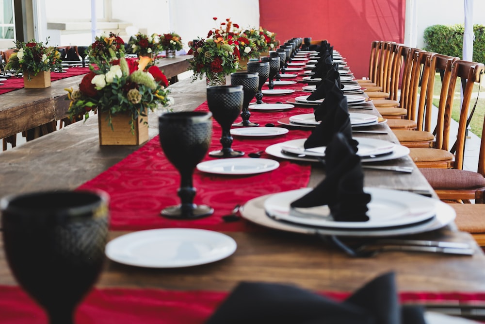 a long table set with place settings and place settings