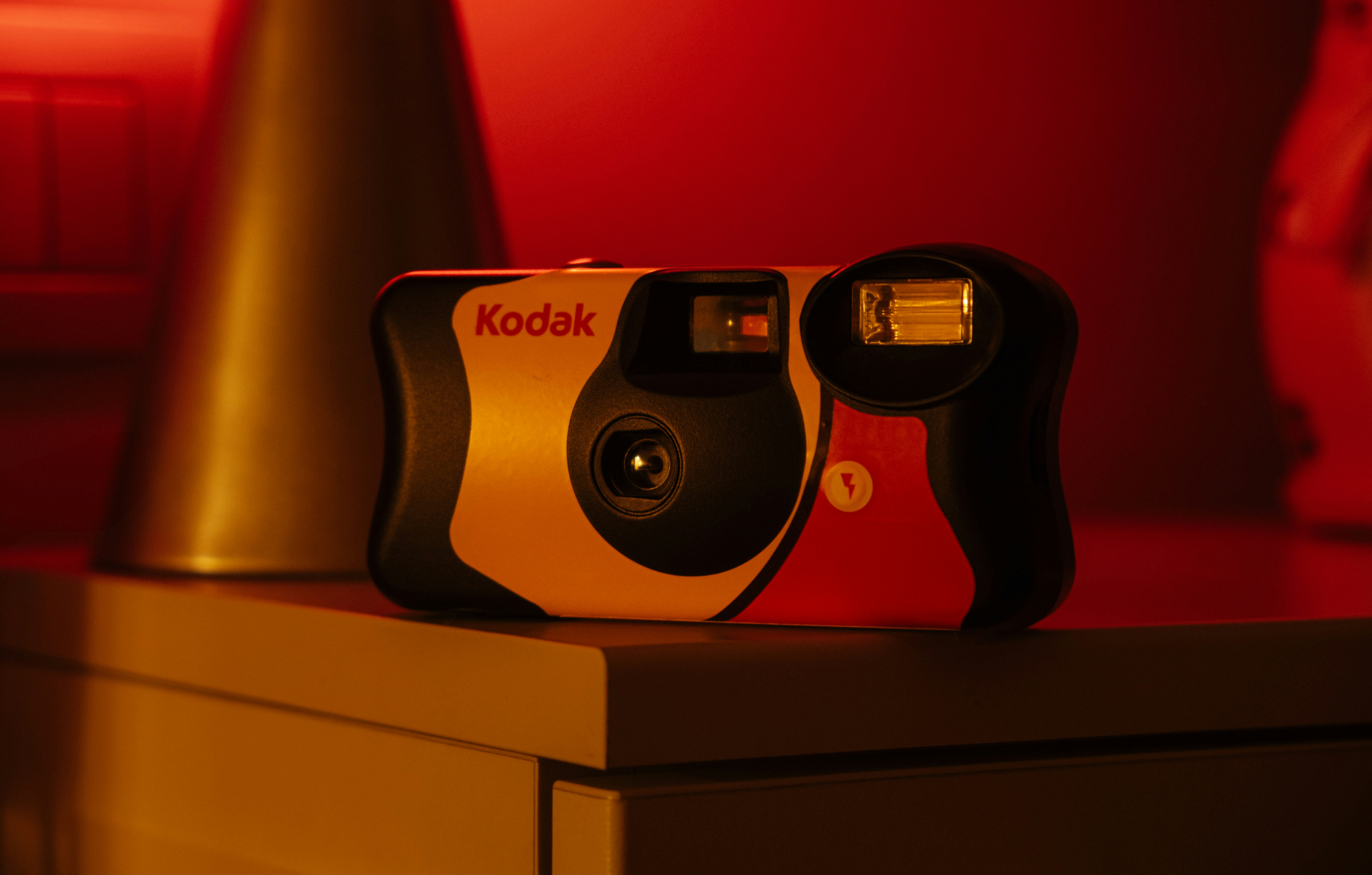 a kodak camera sitting on top of a dresser