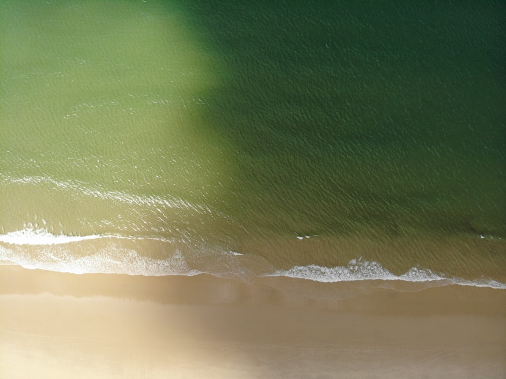 a person riding a surfboard on a wave in the ocean