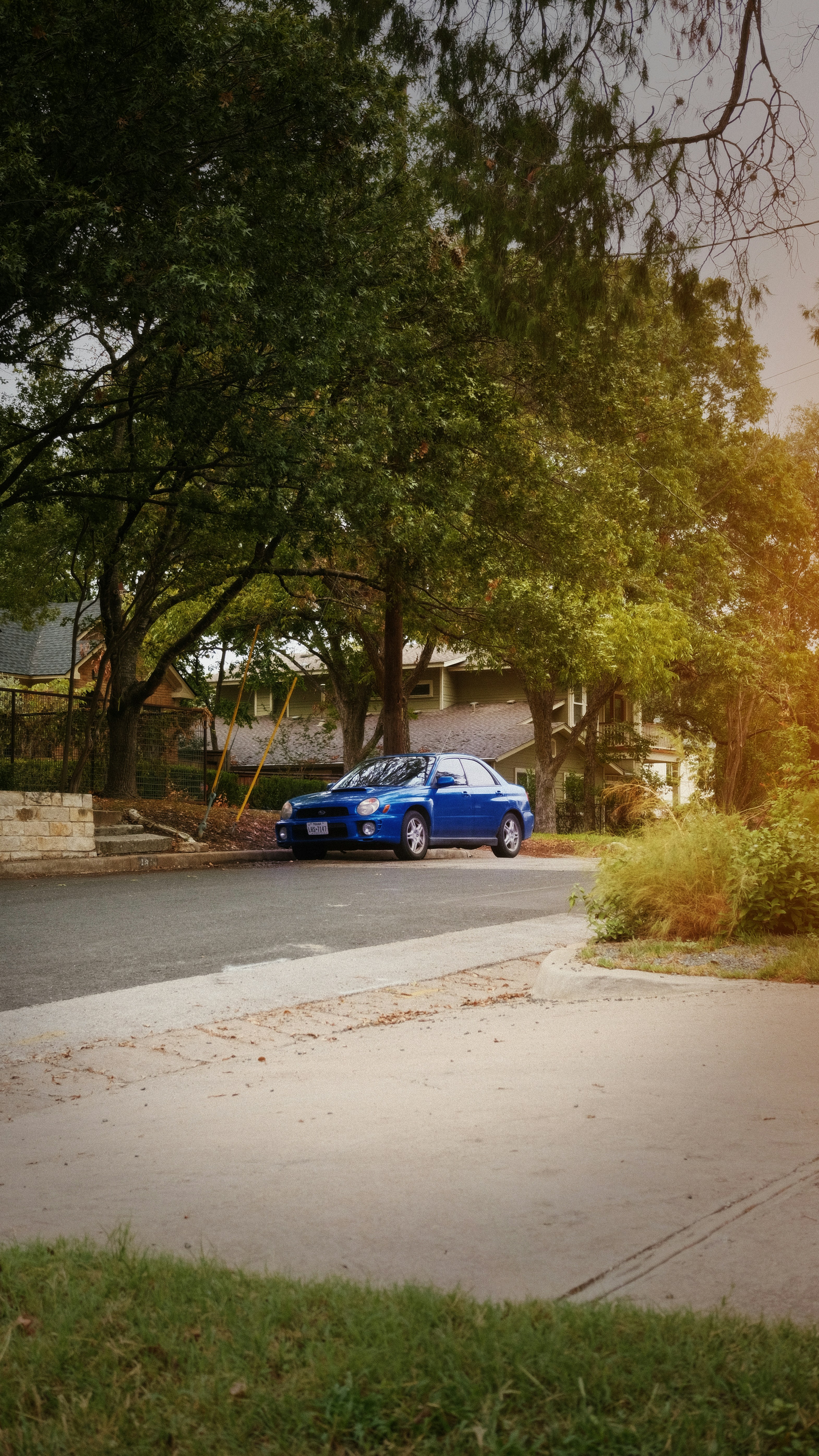 Budget sedan parked in residential area