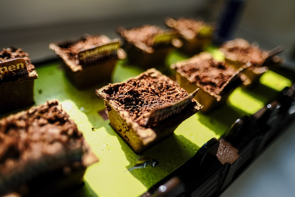 a tray filled with brownies sitting on top of a table