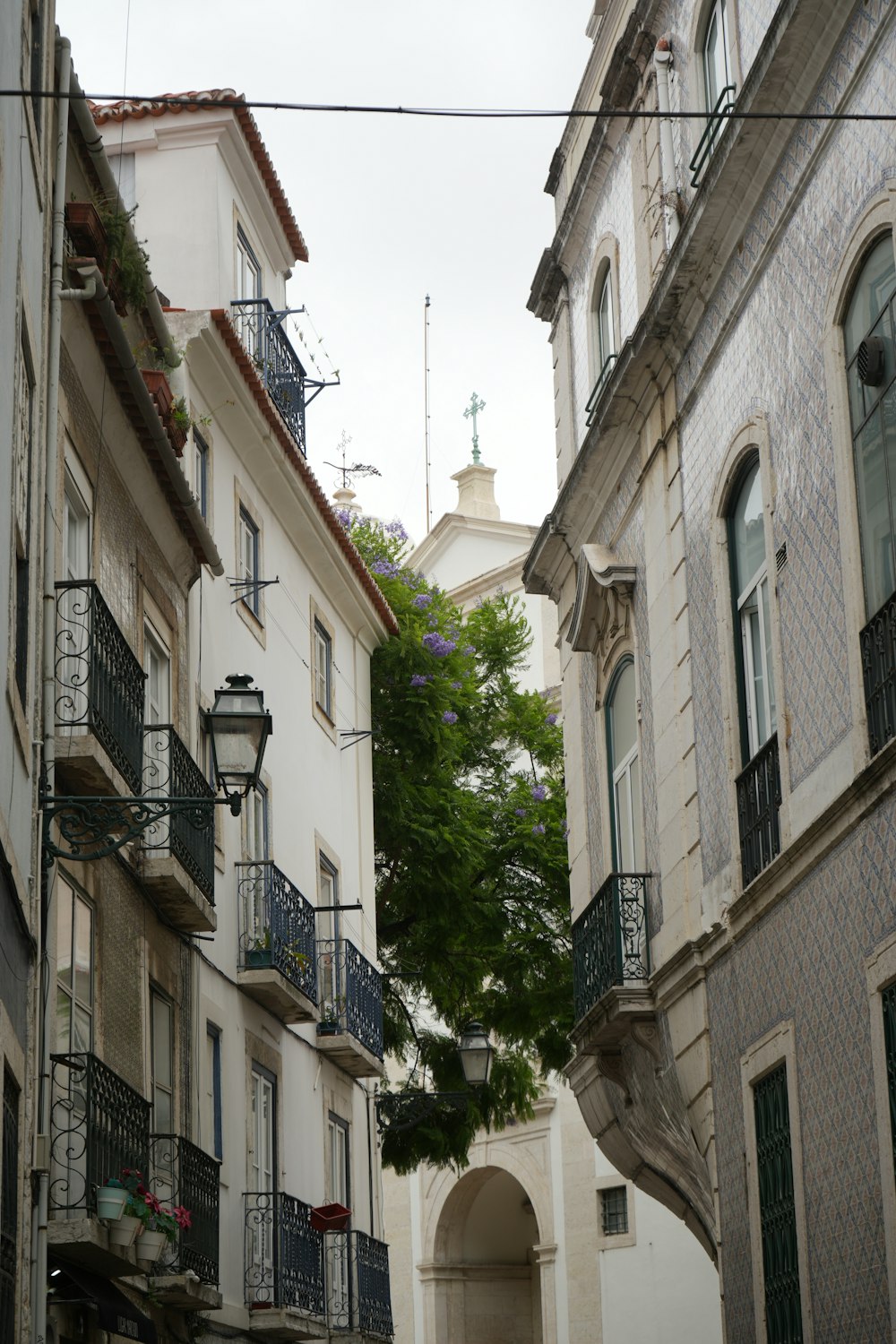 a narrow alleyway with balconies and balconies