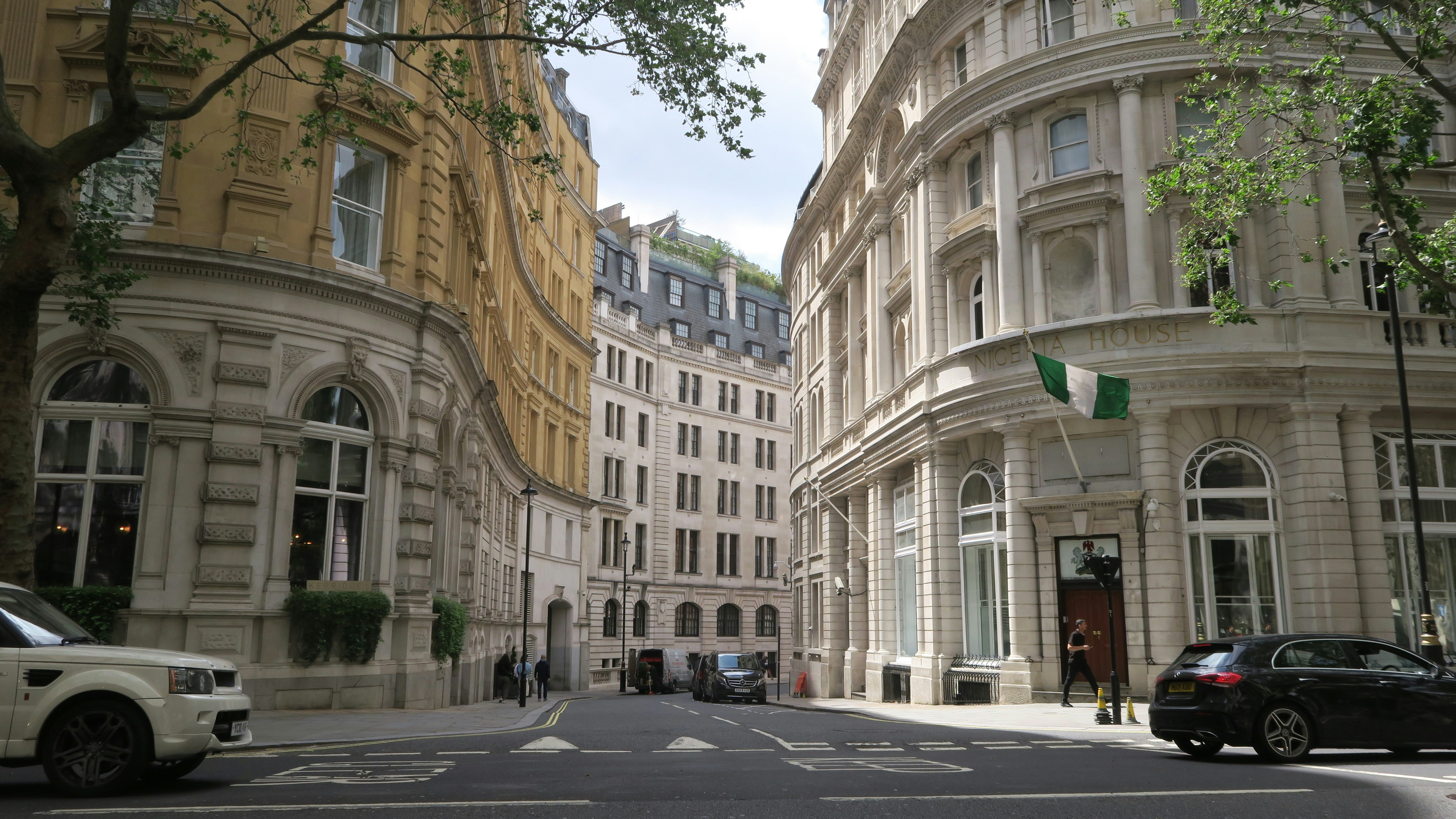 a street with cars parked on both sides of it