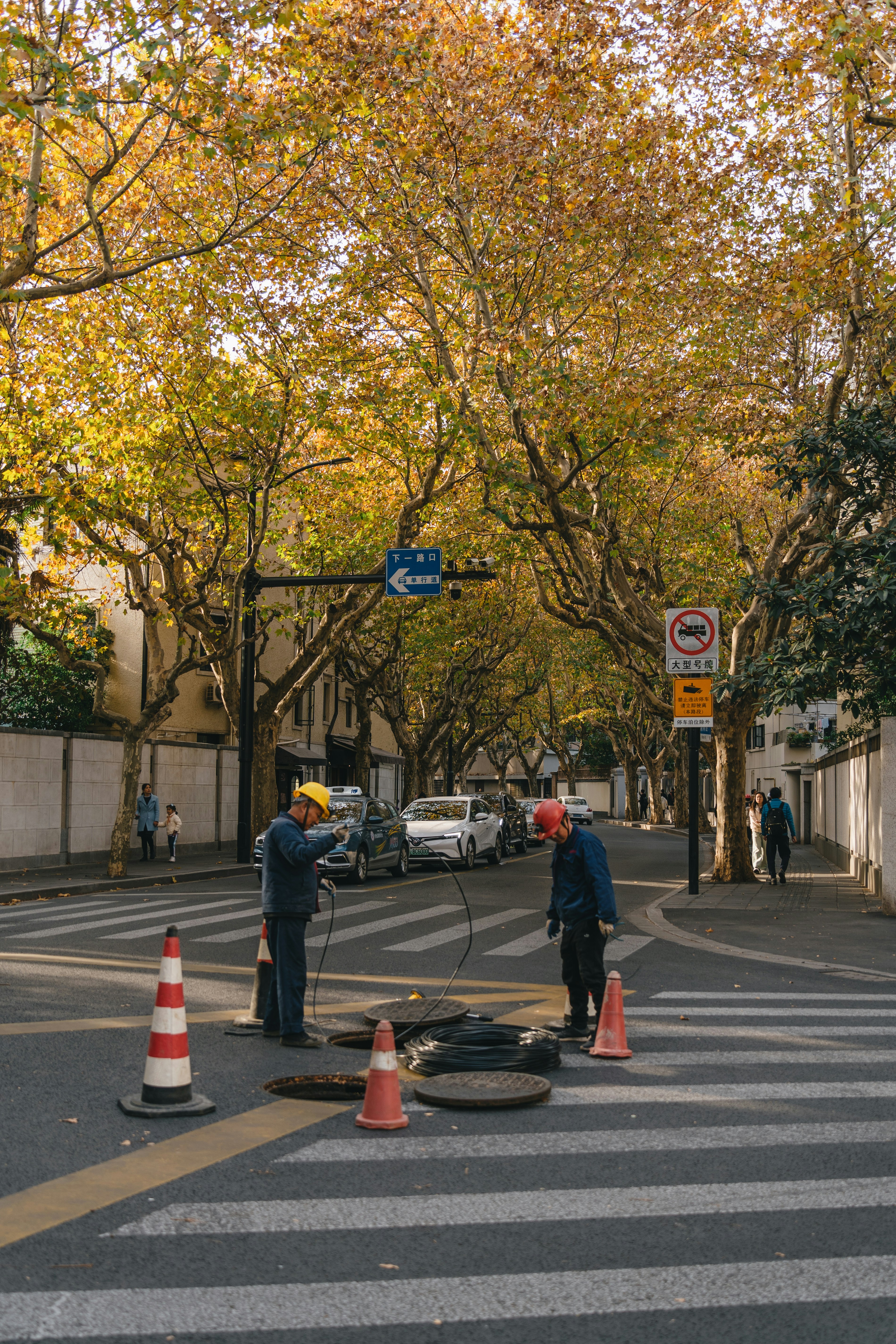 a couple of people that are standing in the street