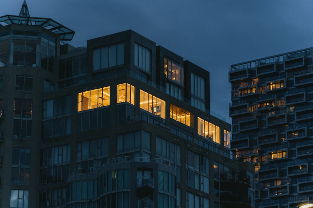 a very tall building with lots of windows at night