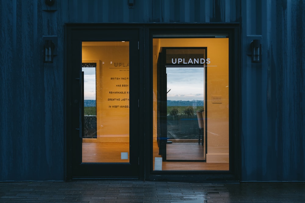 a couple of doors that are open on a building