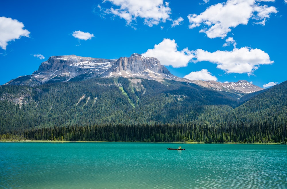 a lake with a mountain in the background