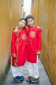 two young boys standing next to each other