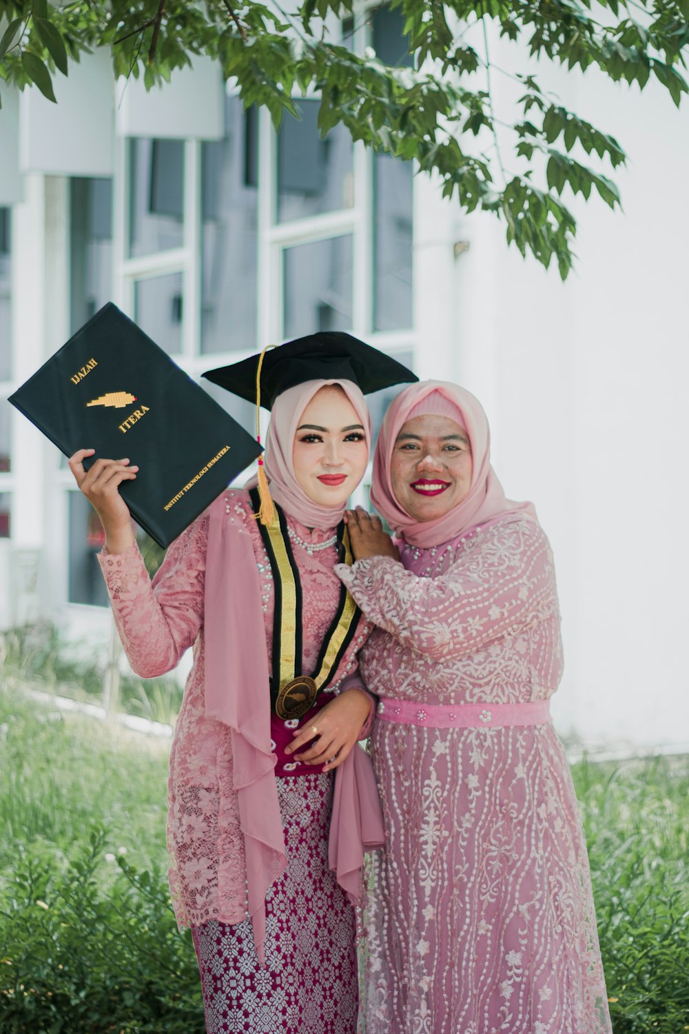 two women in hijabs are posing for a picture