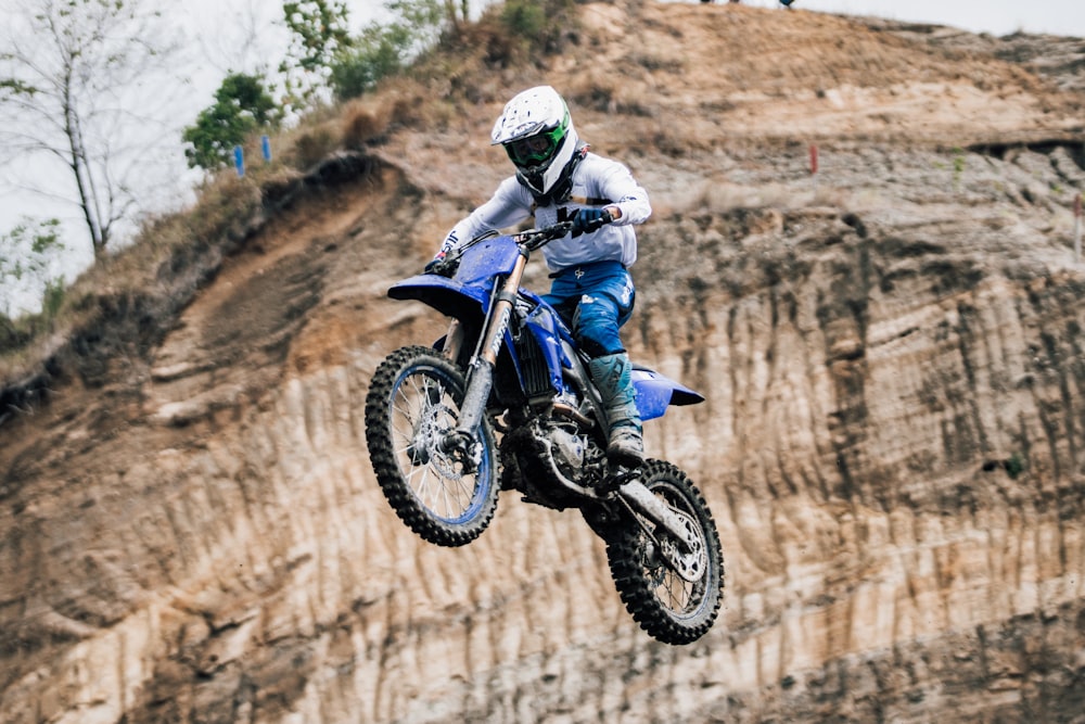 a person on a dirt bike in the air