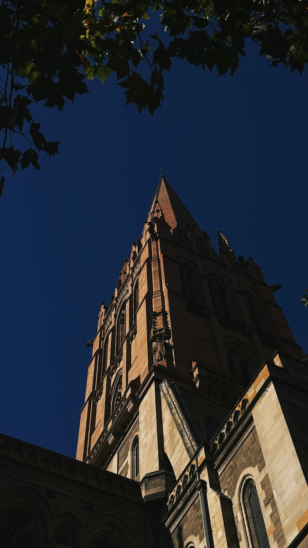 a very tall building with a clock on it's side