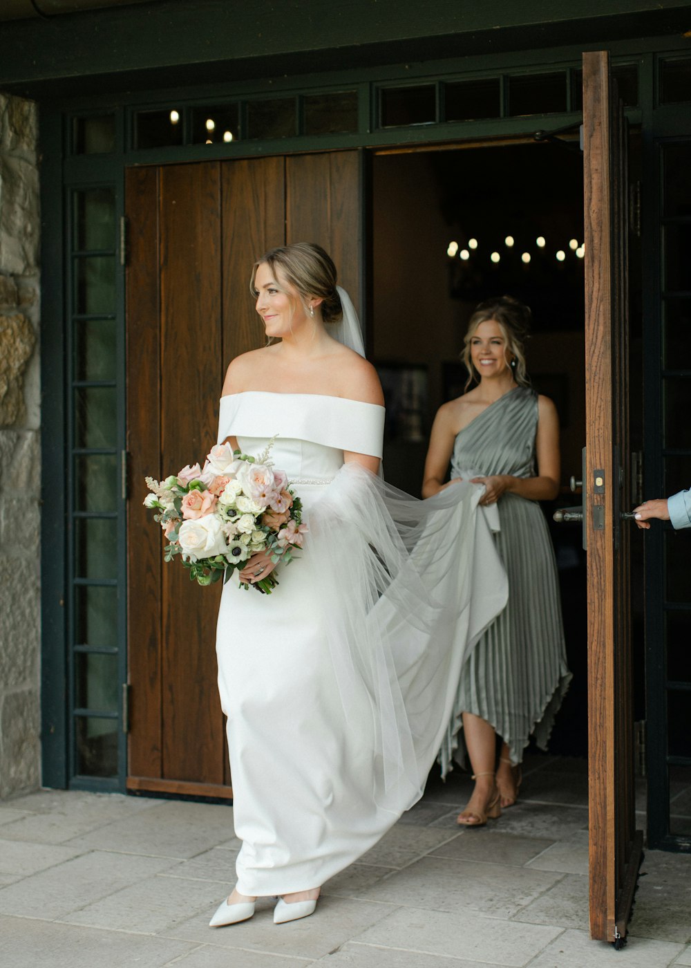 a woman in a white dress and a woman in a gray dress