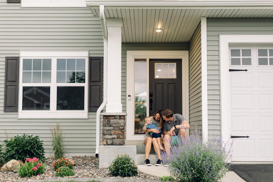 A family on the front steps of their suburban home