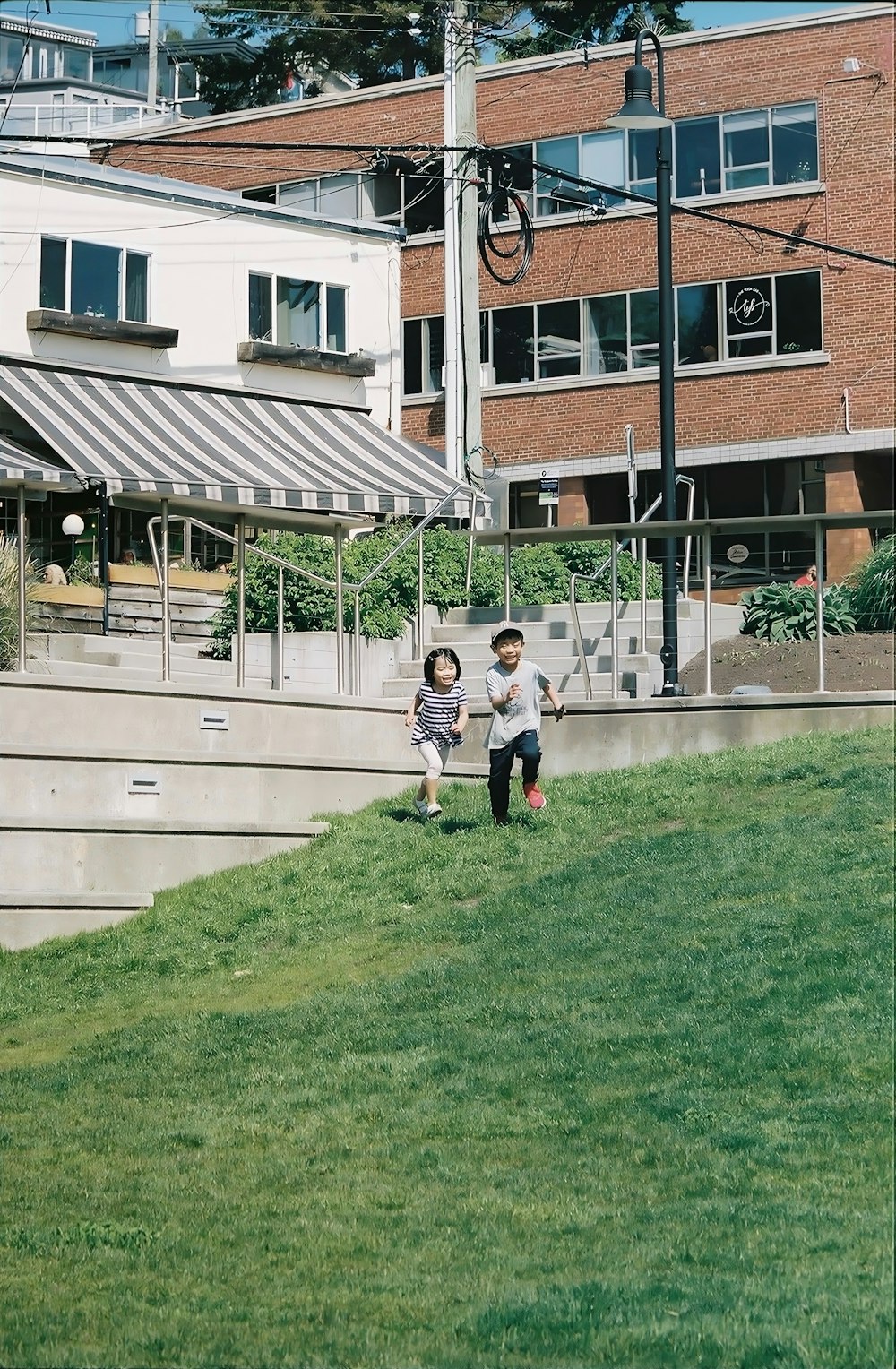 a couple of people that are standing in the grass