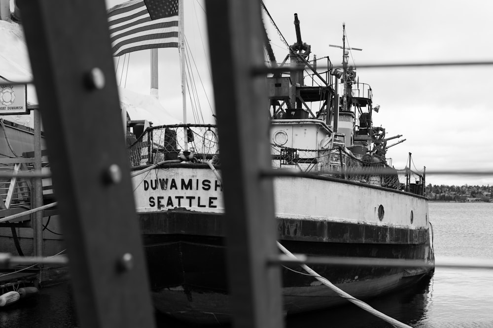 a black and white photo of a boat in the water